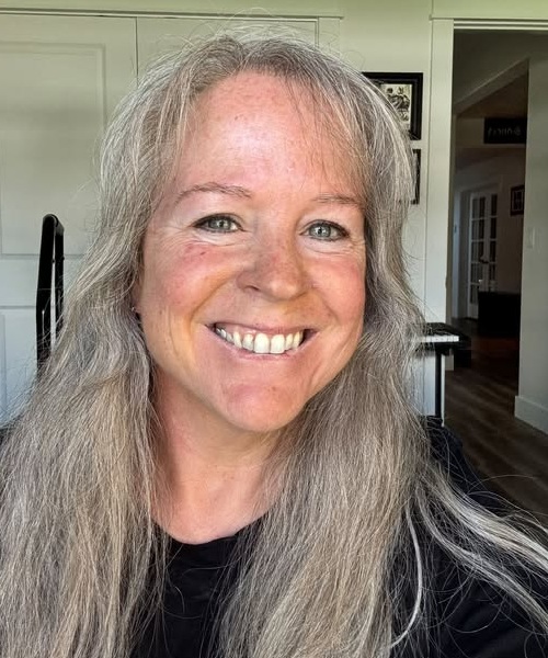 Melissa Bianco smiling, with long silver hair